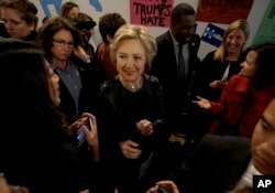 Democratic presidential candidate Hillary Clinton, center, greets supporters as she visits her campaign field office in Oakland, Calif., May 6, 2016.
