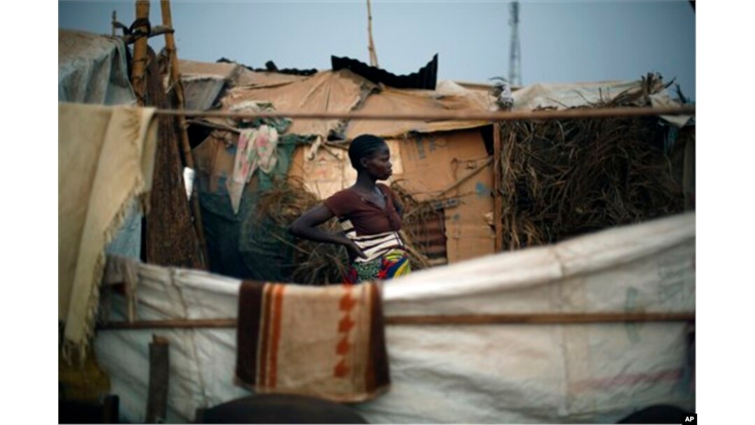 FILE - Christian refugees create a home for themselves in makeshift shelters near the airport in Bangui, Central African Republic, Jan. 28, 2014.