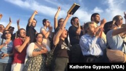 Supporters cheer as Democratic presidential candidate Bernie Sanders speaks outside R.F.K. Stadium, in southeast Washington, June 9, 2016.