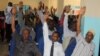 Somali MPs raise their hands during session to impeach Prime Minister Abdi Farah Shirdon, in Mogadishu, Somalia, Dec. 2, 2013.