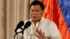 Philippine President Rodrigo Duterte gestures during the 19th Founding Anniversary of the Volunteers Against Crime and Corruption at the Malacanang Presidential Palace in Manila, Philippines, Aug, 16, 2017.