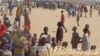 FILE - People who fled their homes due to violence from the Islamic extremists group Boko Haram are seen inside a refugee camp in Minawao, Cameroon, Feb. 25, 2015.