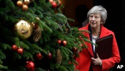 Britain's Prime Minister Theresa May leaves Downing Street in London, Dec. 4, 2018. 