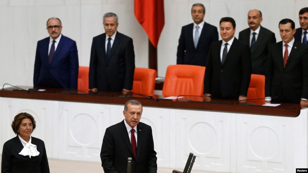 Turkey's new President Tayyip Erdogan (front C) attends a swearing in ceremony at the parliament in Ankara, August 28, 2014.