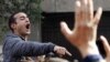 Activist Ahmed Doma shouts slogans against Egyptian President Mohamed Morsi and the Muslim Brotherhood during the funeral of activists Mohamed el-Gendy and Amr Saad in Cairo February 4, 2013.