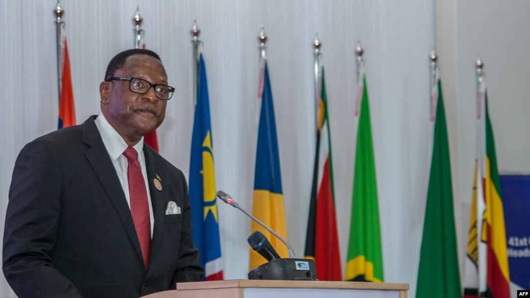 FILE - Malawi President Lazarus Chakwera makes an acceptance speech after taking over the Southern African Development Community (SADC) Chairmanship, in Lilongwe, Malawi, on Aug. 17, 2021.