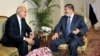 FILE -Nobel Peace Prize winner and one of the leaders of the National Salvation Front, Mohamed ElBaradei (L), meets with Egyptian President Mohammed Morsi, in Cairo, Egypt, November 2012.