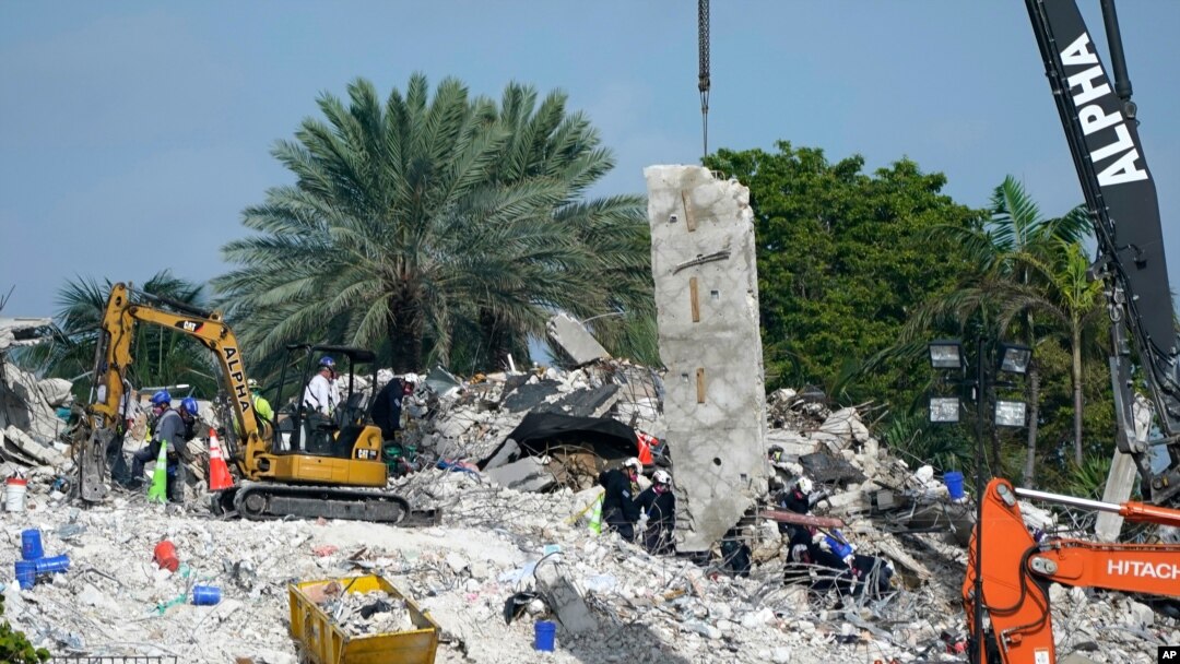 Search and rescue crews work at the site of the collapsed Champlain Towers South condo building after the remaining structure was demolished, in Surfside, Florida, July 5, 2021. 