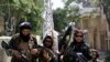 Taliban fighters display their flag as they patrol in Kabul, Afghanistan, Aug. 19, 2021. 