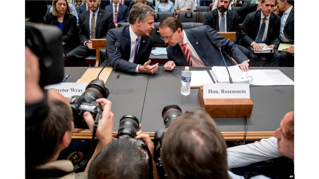 Deputy Attorney General Rod Rosenstein, right, and FBI Director Christopher Wray, left, arrive to testify before a House Judiciary Committee hearing on Capitol Hill in Washington, June 28, 2018.