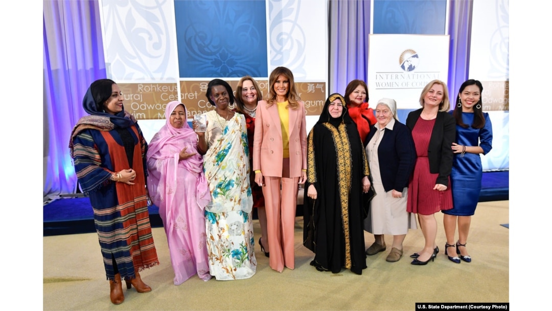 The recipients of the 2018 International Women of Courage awards gather for a group photo with first lady Melania Trump, March 23, 2018, at the State Department in Washington.