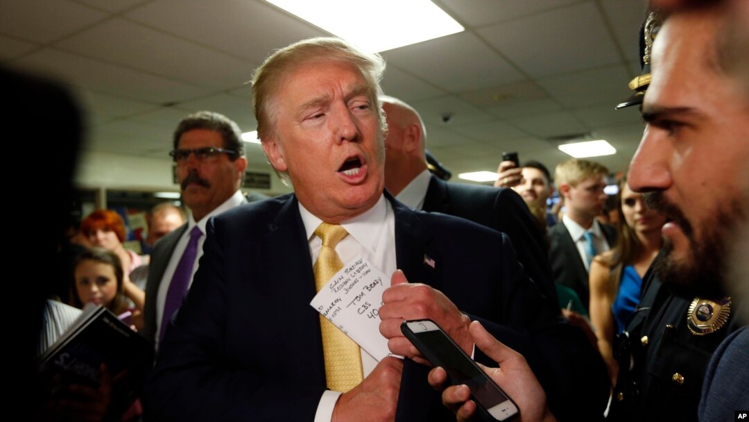 FILE - Republican presidential candidate Donald Trump arrives at a town hall even, Rochester, N.H., Sept. 17, 2015.