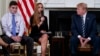 (L-R) Marjory Stoneman Douglas High School student Jonathan Blank, Julia Cordover, the student body president at Marjory Stoneman Douglas High School, President Donald Trump, participate in a listening session with high school students, teachers, and others in the State Dining Room of the White House in Washington.