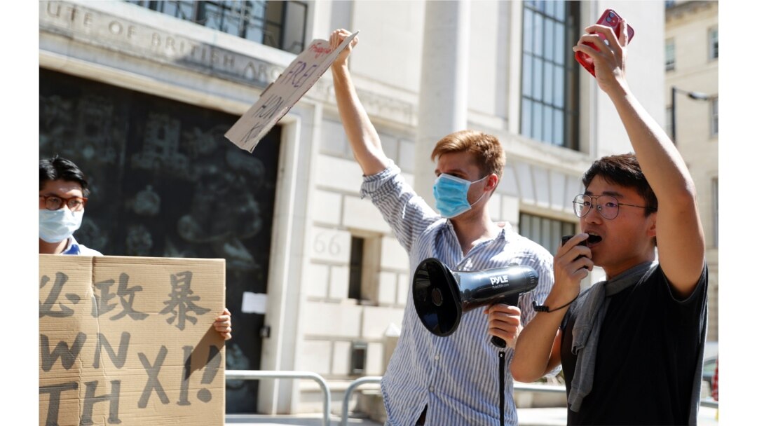 A former British Consulate employee, Simon Cheng, speaks during a protest against Hong Kong's deteriorating freedoms outside China's embassy, in London, July 31, 2020.