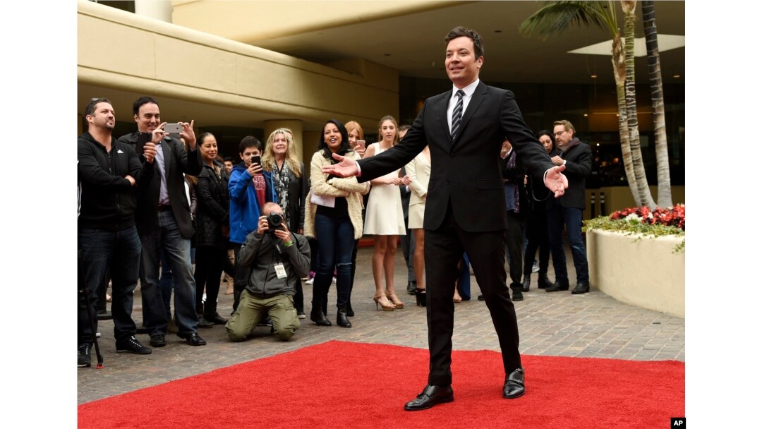 Jimmy Fallon, host of this Sunday's 74th Annual Golden Globe Awards, poses after rolling out the red carpet during Golden Globe Awards Preview Day at the Beverly Hilton on Wednesday, Jan. 4, 2017, in Beverly Hills, Calif.