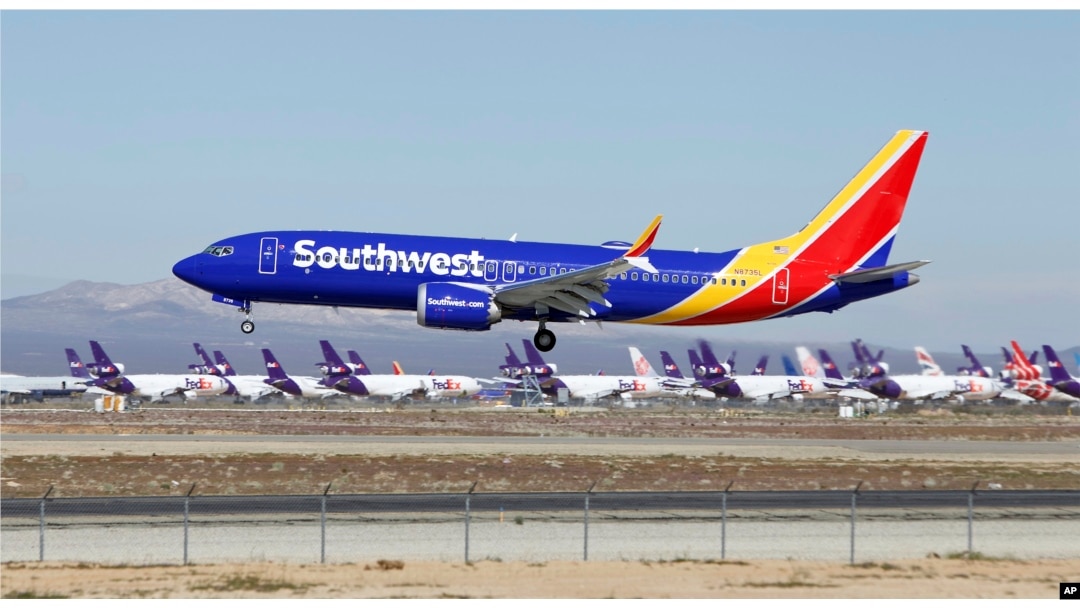 In this March 23, 2019, photo, a Southwest Airlines Boeing 737 Max aircraft lands at the Southern California Logistics Airport in the high desert town of Victorville, Calif. Southwest, which has 34 Max aircraft, is making cancellations five days in advance.