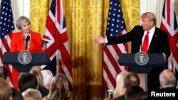 FILE - British Prime Minister Theresa May listens as U.S. President Donald Trump speaks during their joint news conference at the White House in Washington, January 27, 2017.