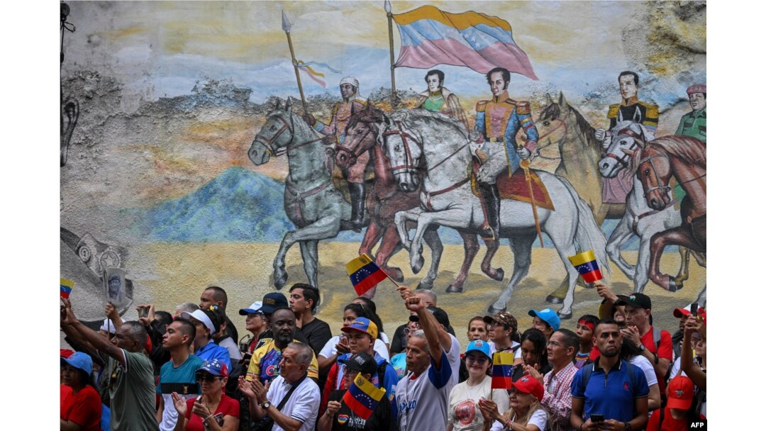 Supporters of Venezuelan President Nicolas Maduro attend a rally called by the ruling party two months after the disputed presidential election in Caracas, Venezuela, Sept. 28, 2024.
