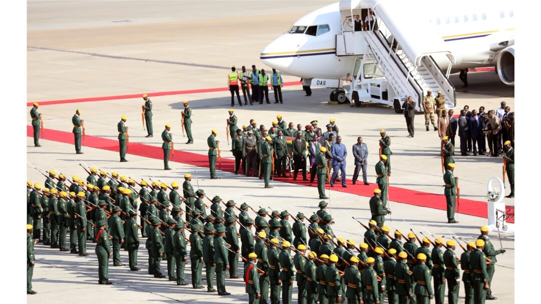 The body of former Zimbabwean President Robert Mugabe arrives back in the country after he died in Singapore after a long illness, Harare, Sept. 11, 2019.