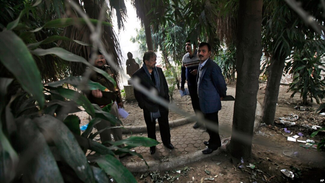 Indian investigators visit a spot which police say is where a Danish tourist was gang-raped in New Delhi, Jan. 15, 2014.
