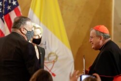 U.S. Secretary of State Mike Pompeo, left, and U.S. Ambassador to the Holy See Callista Gingrich greet Cardinal Raymond Burke, right, during a symposium in Rome, Sept. 30, 2020.