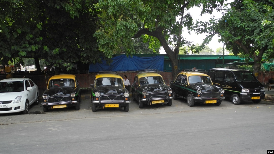 Ambassador taxis parked in a row.