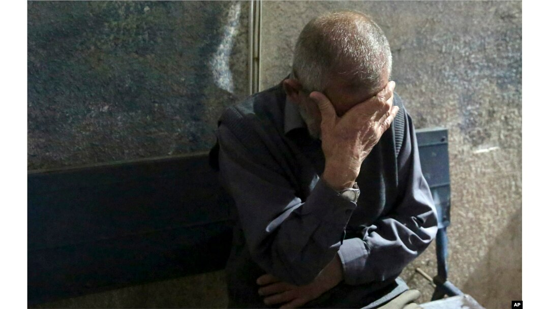 A relative reacts outside the morgue of Al-Aqsa hospital in Deir el-Balah, central Gaza Strip, after seeing the bodies of two Hamas militants who were killed during an Israeli airstrike, May 3, 2019.