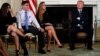 Parent Melissa Blank, from left, and Marjory Stoneman Douglas High School shooting surviving students Jonathan Blank and Julia Cordover attend with other survivors and the families of victims a listening session held by U.S. President Donald Trump to discuss school safety and shootings, at the White House in Washington, Feb. 21, 2018. 