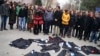 Academics lay down their gowns during a protest against the dismissal of academics from universities following a post-coup emergency decree, in the Cebeci campus of Ankara University in Turkey, Feb. 10, 2017.