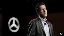 FILE - Dietmar Exler, president and CEO of Mercedes Benz USA, addresses the media during the North American International Auto show, Jan. 8, 2017, in Detroit. German business leaders are expressing concerns that President Donald Trump's 25 percent tariff on imported steel could affect the auto industry in the South. 