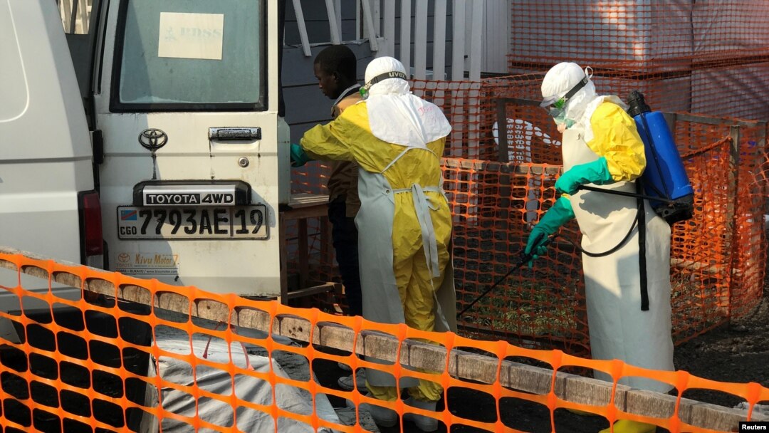 A health worker sprays disinfectant on an ambulance at a Health Centre in Goma, Democratic Republic of Congo, July 18, 2019. 