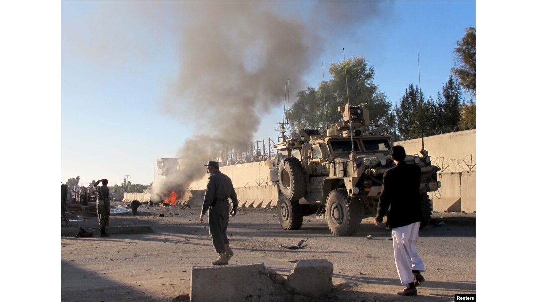 FILE - Smoke bellows after a suicide car bomb blast attacked a military convoy in Lashkar Gah, Helmand province, Afghanistan, Nov. 15, 2015.
