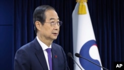 FILE - South Korean acting President Han Duck-soo speaks at the government complex in Seoul, South Korea, Dec. 26, 2024.