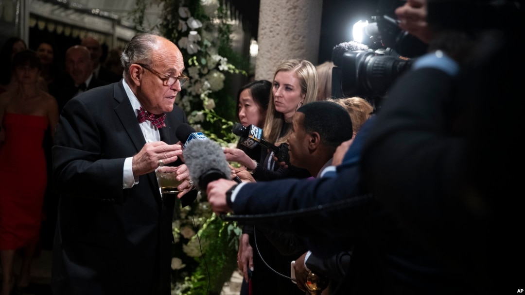U.S. President Donald Trump's personal attorney Rudy Giuliani speaks to reporters as he arrives for a New Year's Eve party hosted by Trump at his Mar-a-Lago property, Dec. 31, 2019, in Palm Beach, Florida.