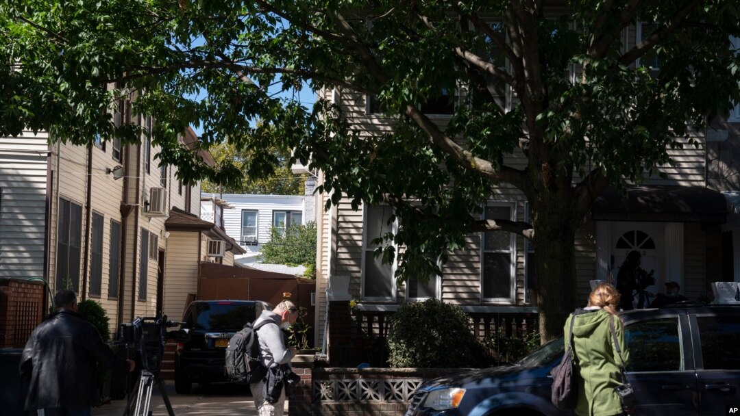 Members of the media gather on Sept. 19, 2020, in front of the childhood home of Justice Ruth Bader Ginsburg in the Brooklyn borough of New York.