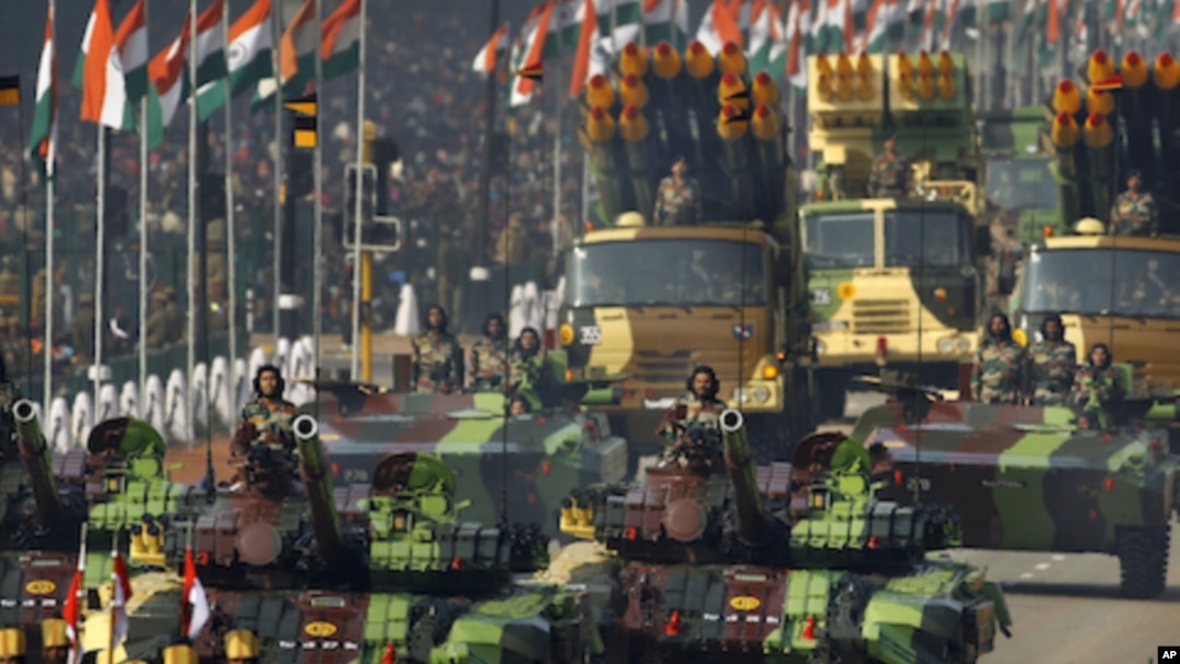 Indian army soldiers ride on T-72 tanks during the main Republic Day parade in New Delhi, January 26, 2012. 