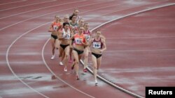 FILE - Russian runners compete in the women's 800 meters at the 58th Brothers Znamensky Memorial track and field meeting, June 4, 2016.