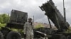 A U.S. soldier stands next to a Patriot surface-to-air missile battery at an army base in Morag, Poland. (File)