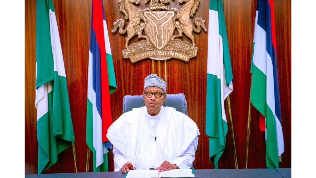 In this photo released by the Nigeria State House, Nigeria's President Muhammadu Buhari addresses the nation in a live televised broadcast, Oct. 22, 2020.