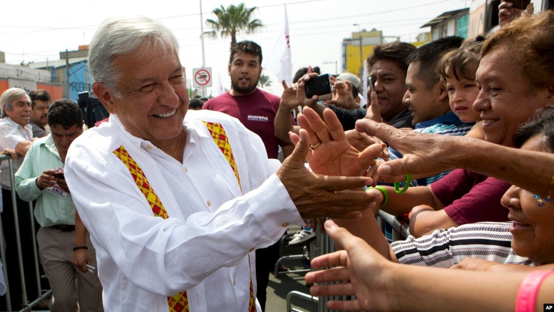 Presidential hopeful and two-time candidate Andres Manuel Lopez Obrador greets supporters as he arrives at a campaign rally for Delfina Gomez, who is running for Mexico state governor with his National Regeneration Movement, or MORENA, in Nezahualcoyotl, Mexico state, May 28, 2017.