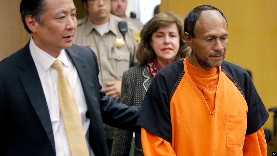 FILE - Jose Ines Garcia Zarate, right, is led into the courtroom by San Francisco Public Defender Jeff Adachi, left, and Assistant District Attorney Diana Garcia, center, for his arraignment in San Francisco, July 7, 2015.