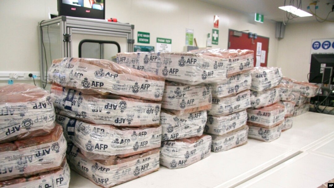 FILE - Packages of cocaine sit at a facility in Sydney, Australia, in this undated photo provided by Australian Federal Police.