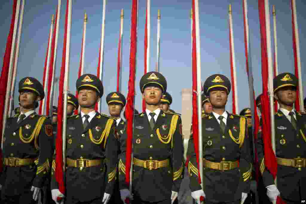 Flagbearers of a Chinese honor guard stand in formation before a welcome ceremony for Argentina's President Mauricio Macri at the Great Hall of the People in Beijing.