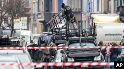 Special forces police install special equipment on a van in Ghent, western Belgium, Dec. 15, 2014. 