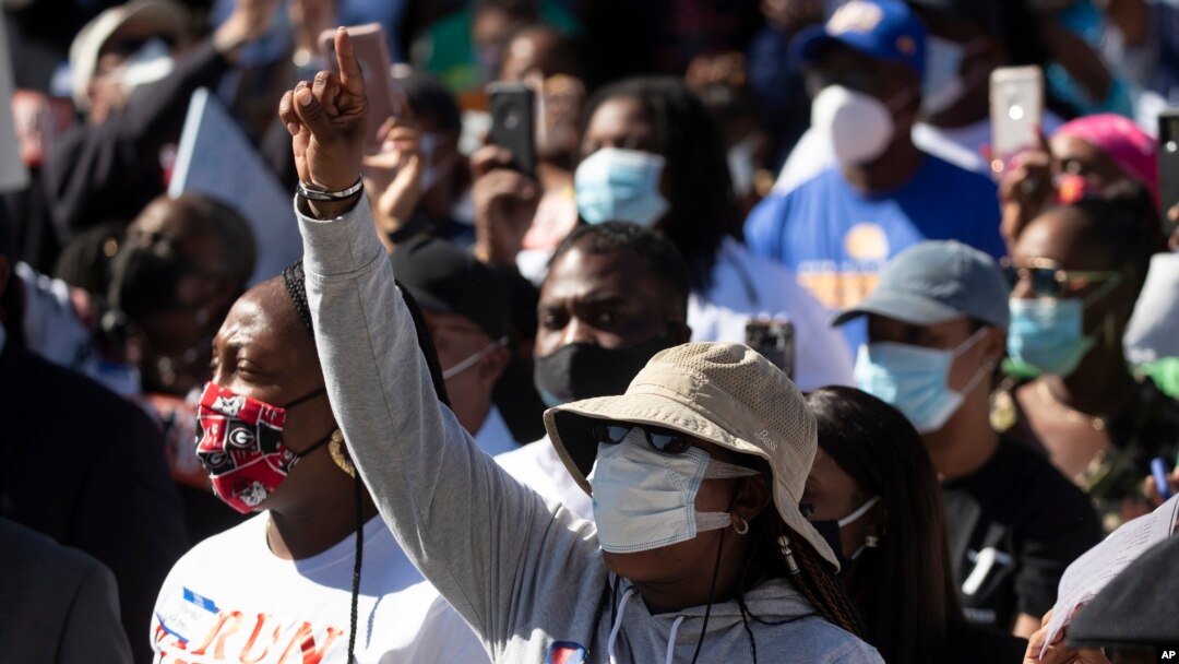 FILE - Demonstrators rally to protest the shooting of Ahmaud Arbery, in Brunswick, Georgia, May 8, 2020. 