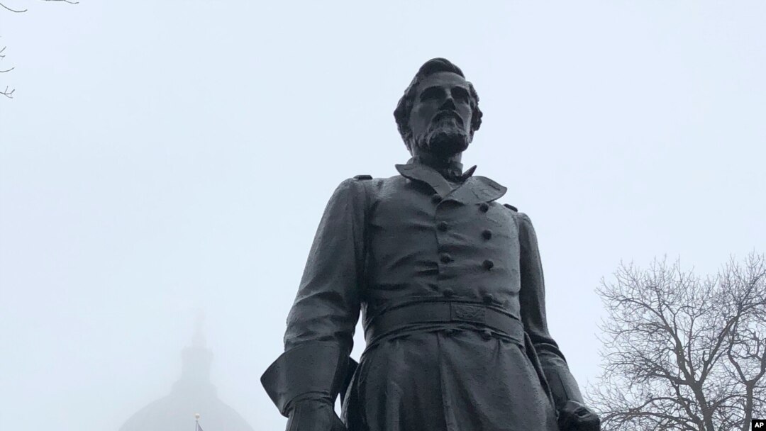 A statue of Civil War hero Hans Christian Heg is seen on March 11, 2020, outside the Wisconsin state Capitol, in Madison, Wis. The Wisconsin abolitionist's descendants are imploring state officials to repair and reinstall the statue. 