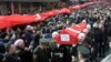 FILE - People carry the coffin after funeral prayers for Turkish soldier Goktan Ozupekin, who was killed with 15 others by IS militants in al-Bab, Syria, in Kirklareli , Turkey, Dec. 23, 2016.