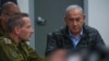 FILE - This screen grab taken from a handout video released by the Israeli government press office shows Prime Minister Benjamin Netanyahu attending a meeting in the command center of the defense ministry in Tel Aviv on Oct. 26, 2024.