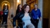 FILE - Sen. Tammy Duckworth, D-Ill. arrives for a closed-door Democratic policy luncheon on Capitol Hill in Washington.