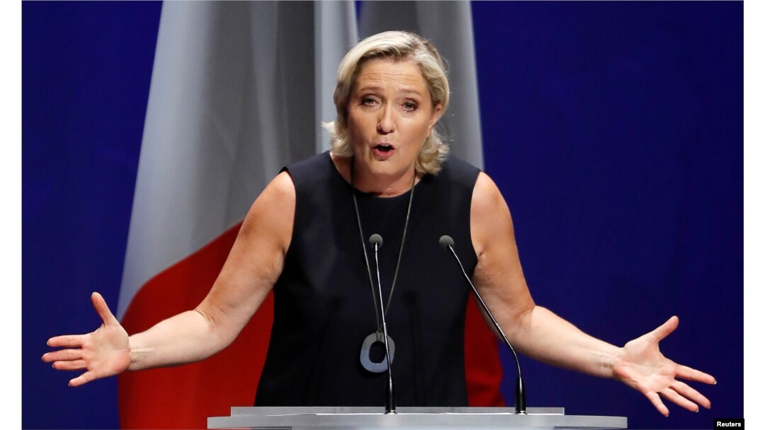 FILE - French far-right National Rally (Rassemblement National) party leader Marine Le Pen delivers her comeback speech in Frejus, France, Sept. 16, 2018.